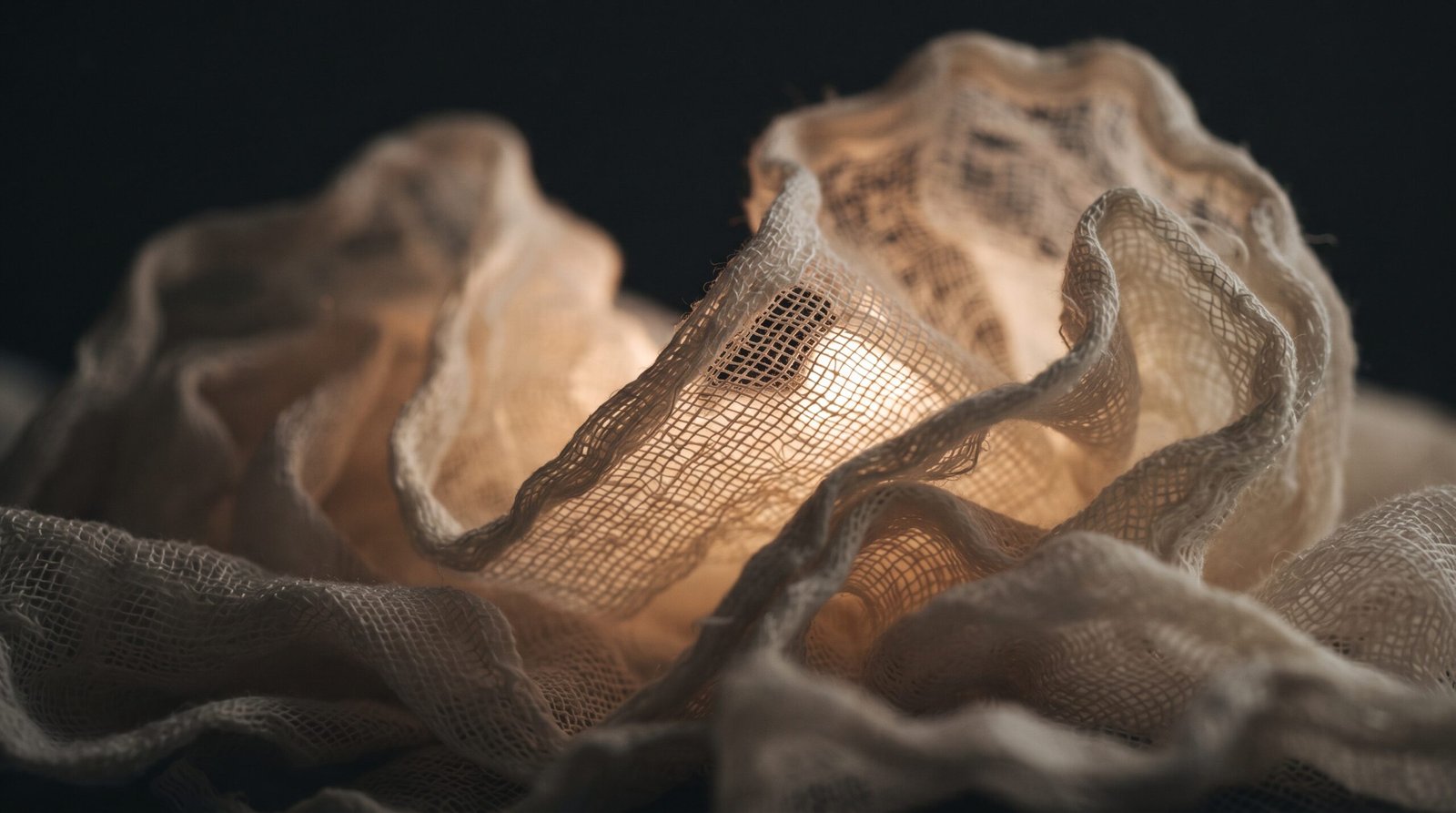 Close-up of the stiffened open-weave fabric folds that give cheesecloth ghosts their drape